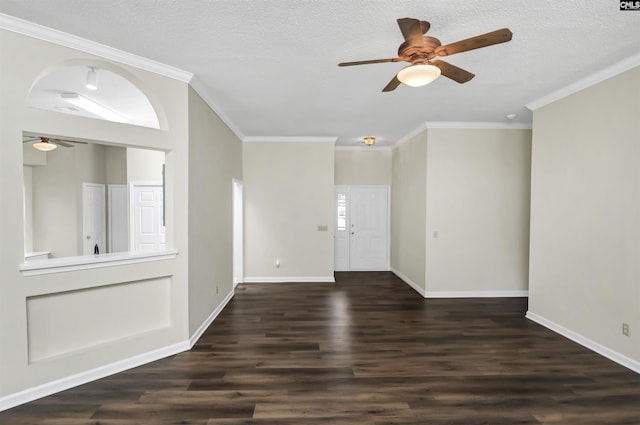 foyer with ceiling fan, dark wood-type flooring, ornamental molding, and a textured ceiling