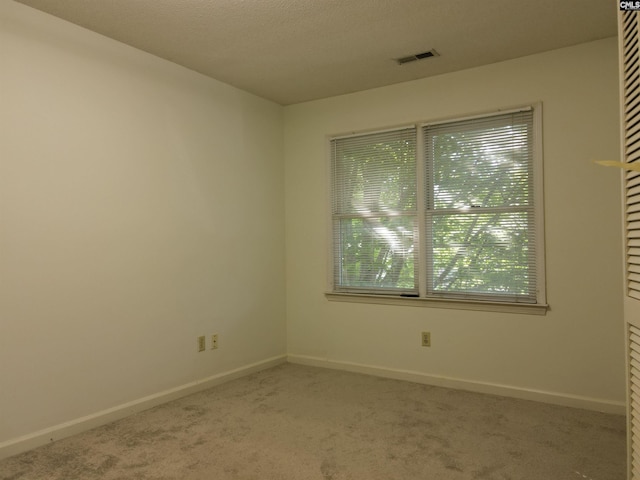 empty room with carpet flooring