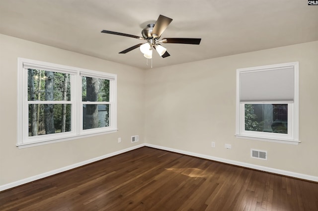 empty room with ceiling fan and hardwood / wood-style floors