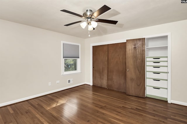 unfurnished bedroom with dark hardwood / wood-style floors and ceiling fan