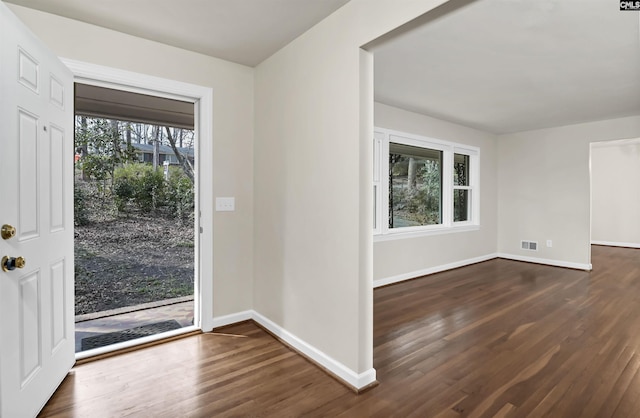 entrance foyer featuring dark hardwood / wood-style floors