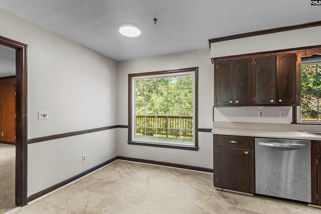 kitchen with dark brown cabinetry, dishwasher, and a textured ceiling