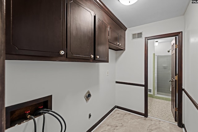 washroom with cabinets, hookup for a washing machine, and electric dryer hookup