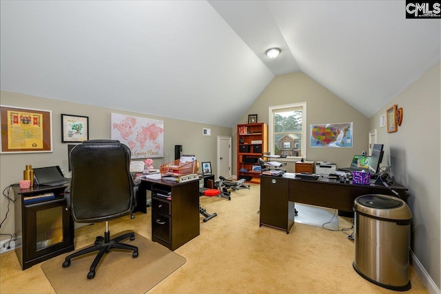 carpeted office featuring lofted ceiling