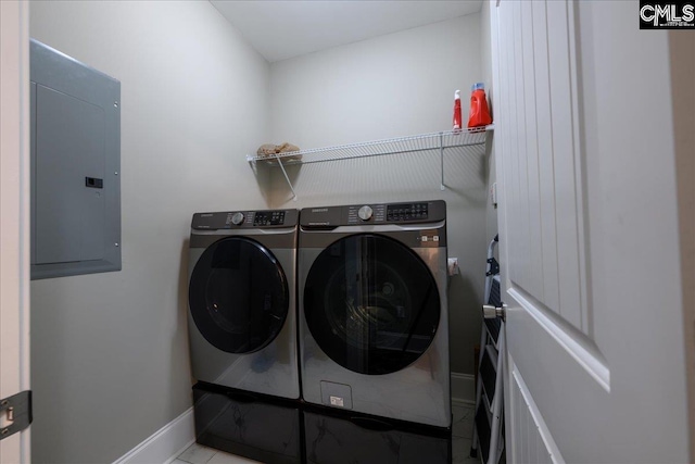 washroom featuring electric panel and washing machine and dryer