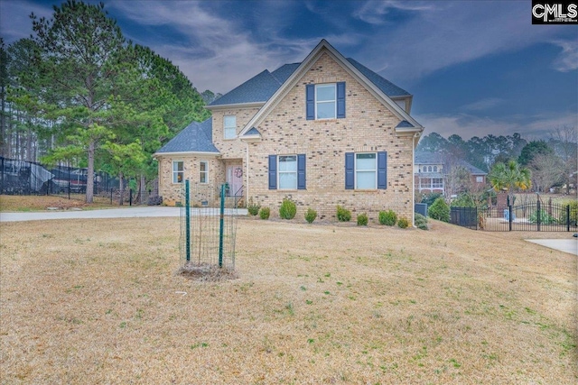 craftsman-style home with a front lawn