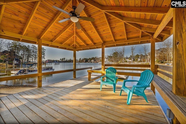 view of dock featuring a gazebo and a water view