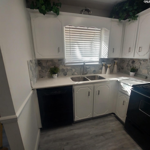 kitchen featuring white cabinetry, sink, dishwasher, and range