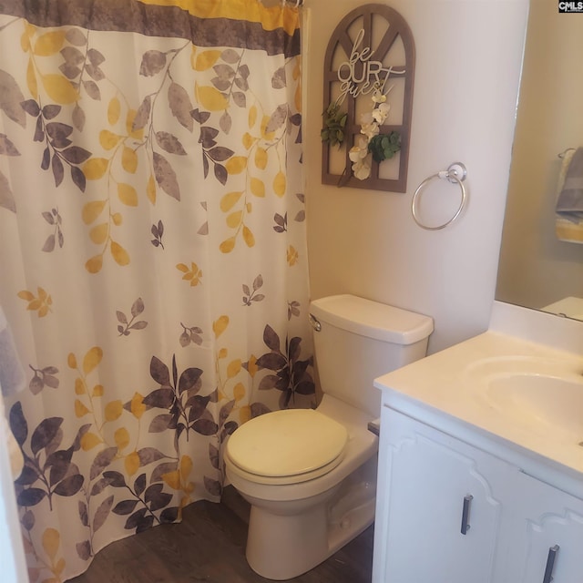 bathroom featuring a shower with curtain, vanity, toilet, and hardwood / wood-style floors