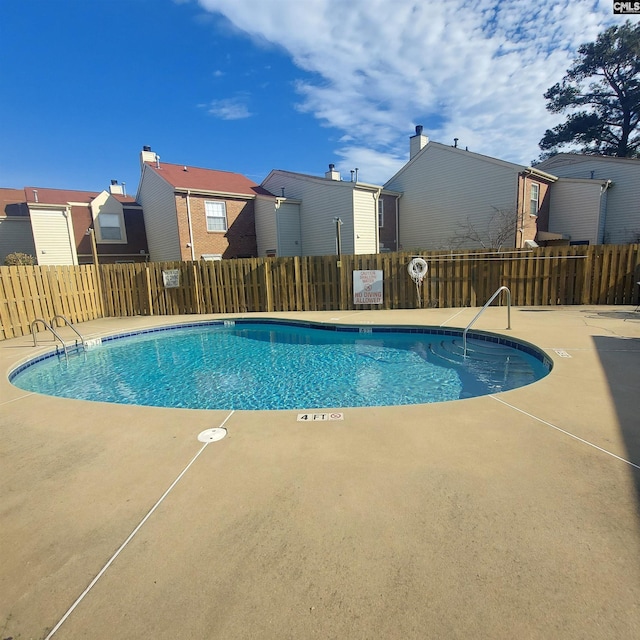 view of swimming pool with a patio area