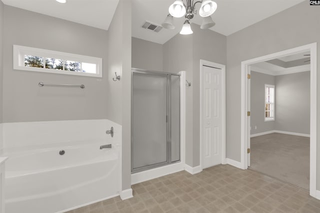 bathroom with separate shower and tub