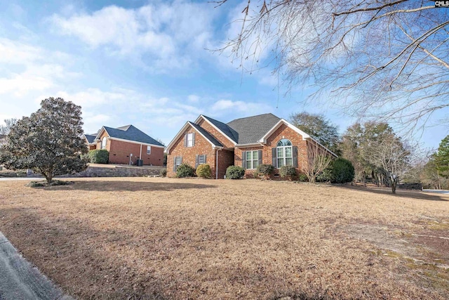 single story home featuring a front yard