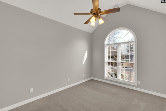 carpeted empty room featuring lofted ceiling and ceiling fan