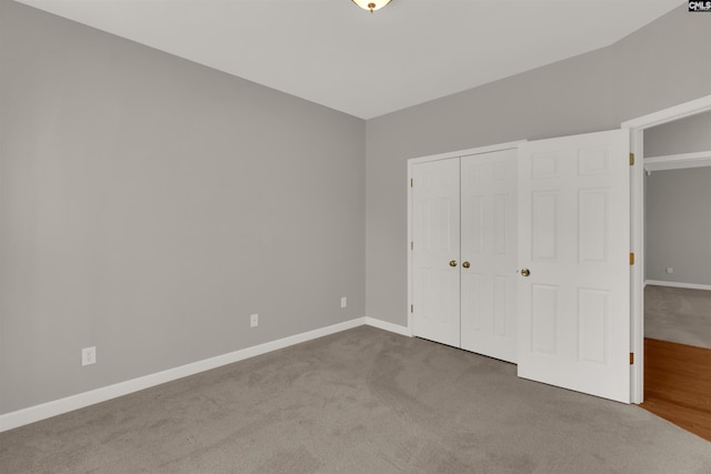 unfurnished bedroom with a closet and carpet