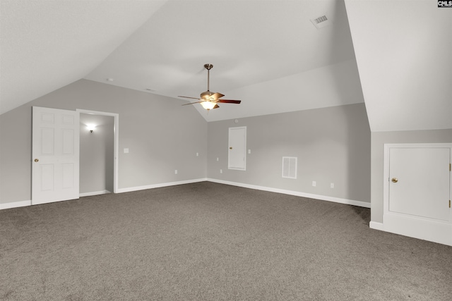 bonus room featuring vaulted ceiling, ceiling fan, and dark colored carpet