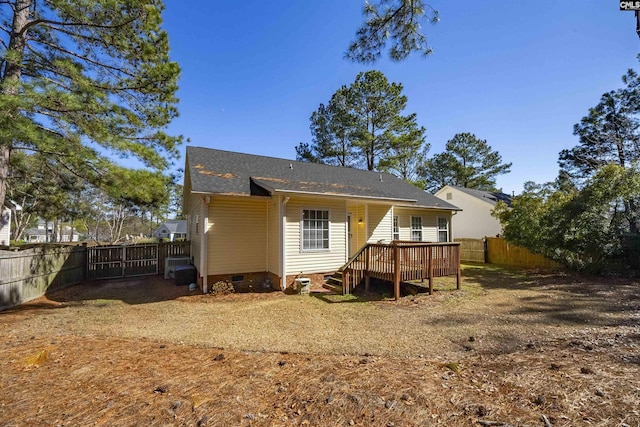 back of property featuring a deck