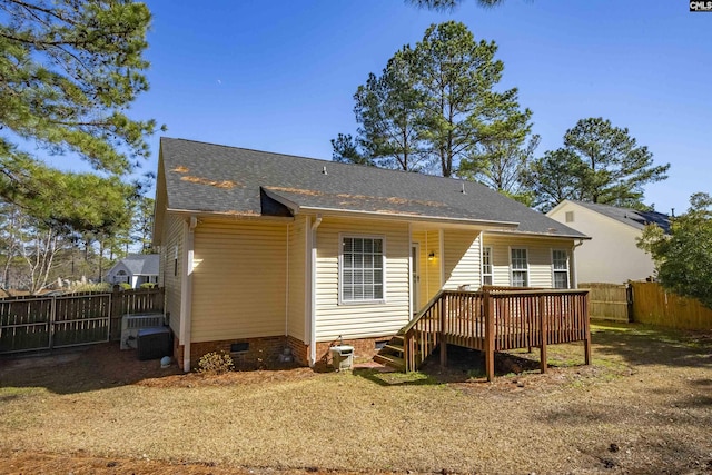 back of property featuring central AC unit and a deck