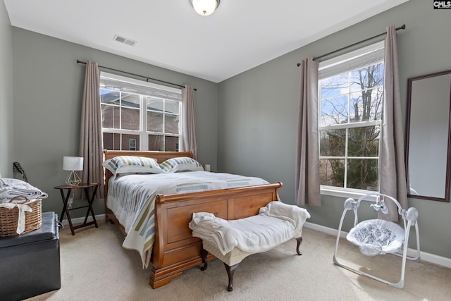 bedroom featuring light carpet