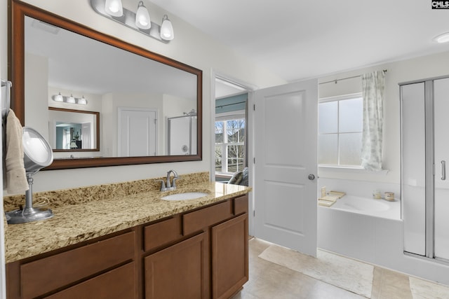 bathroom with independent shower and bath and vanity