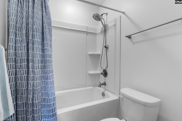 bathroom with shower / bath combination and toilet