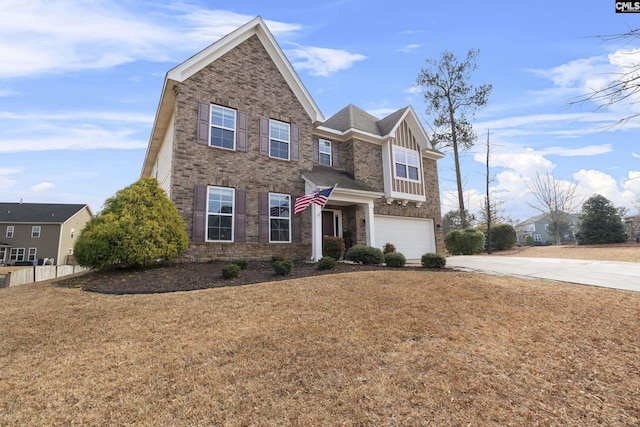 view of front of property with a garage and a front yard