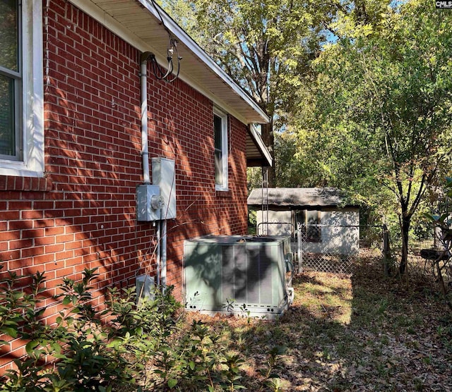 view of side of property with central AC