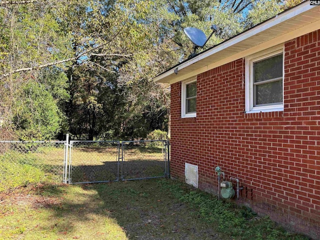 view of side of property with a lawn