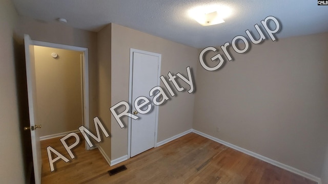 interior details featuring hardwood / wood-style floors