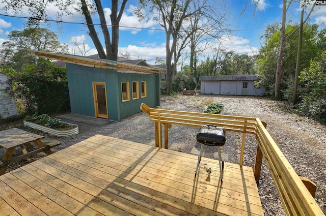 wooden deck featuring a storage shed