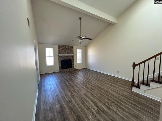 unfurnished living room with a stone fireplace, high vaulted ceiling, beamed ceiling, dark hardwood / wood-style flooring, and ceiling fan