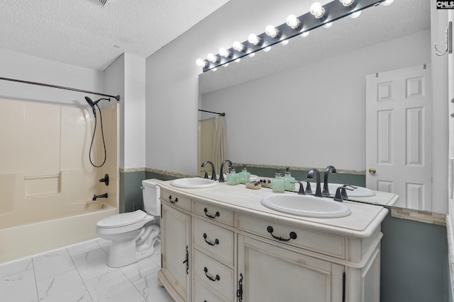 full bathroom with vanity, shower / bath combination with curtain, a textured ceiling, and toilet