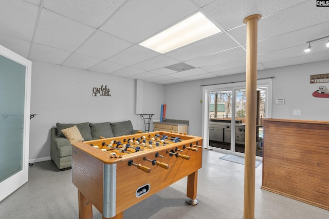 recreation room with a drop ceiling