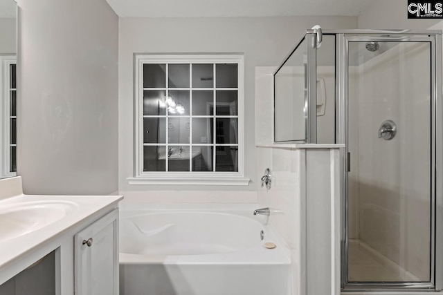 bathroom with vanity and plus walk in shower