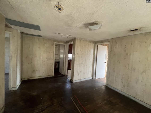 spare room featuring a textured ceiling