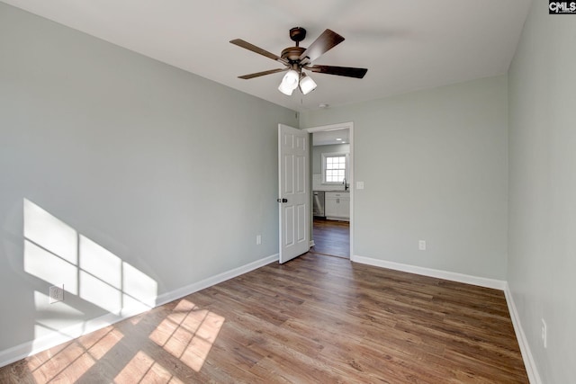 spare room featuring hardwood / wood-style flooring and ceiling fan