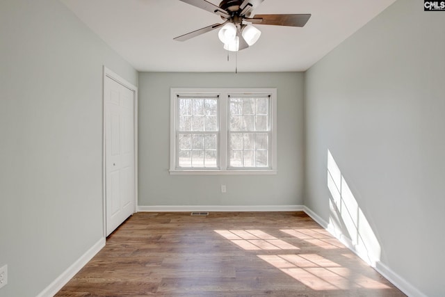 unfurnished room featuring ceiling fan and light hardwood / wood-style flooring