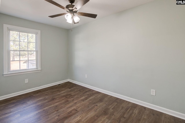 unfurnished room with dark wood-type flooring and ceiling fan