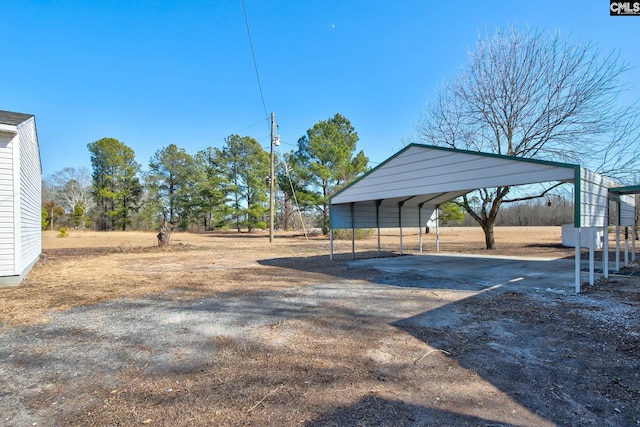 view of yard with a carport