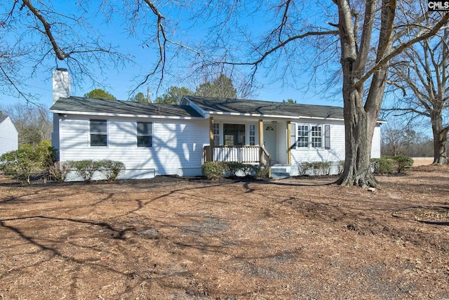 ranch-style home featuring covered porch