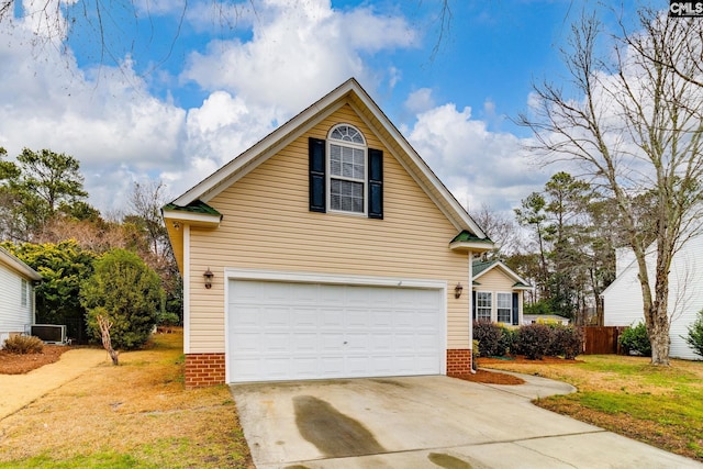 view of front property with a garage and a front yard