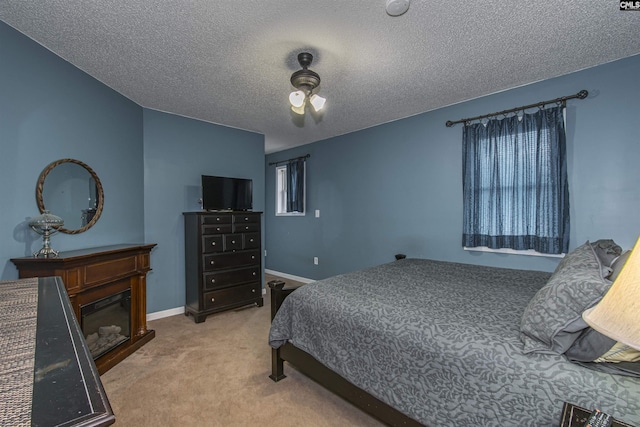 carpeted bedroom featuring a textured ceiling