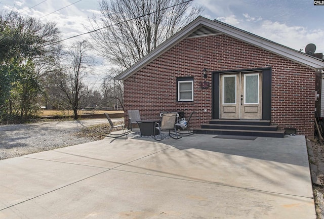 back of property featuring a patio