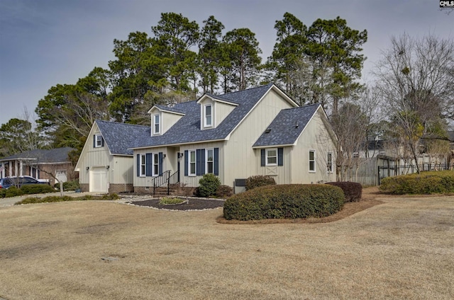 new england style home featuring a garage