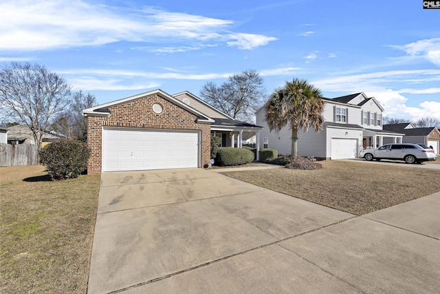 view of front of property with a garage and a front yard