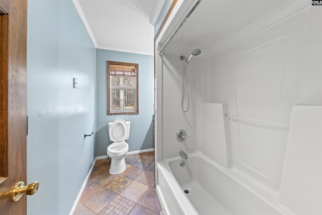 bathroom with ornamental molding, bathtub / shower combination, a textured ceiling, and toilet