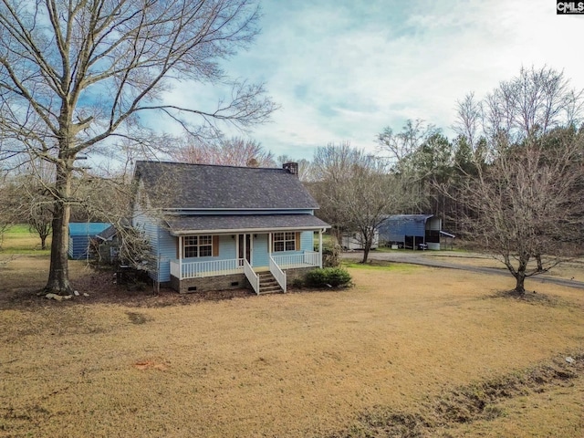 view of front of home featuring a front yard and covered porch