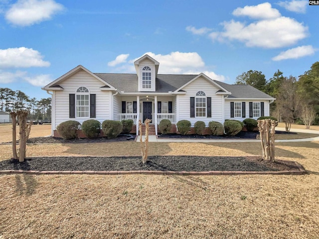 view of front facade with a porch and a front yard