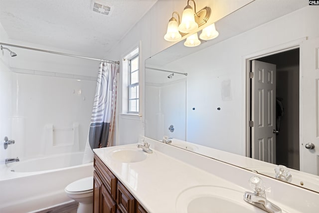 full bathroom with toilet, a chandelier, a textured ceiling, vanity, and shower / bathtub combination with curtain