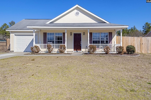 view of front facade featuring a garage, a porch, and a front lawn