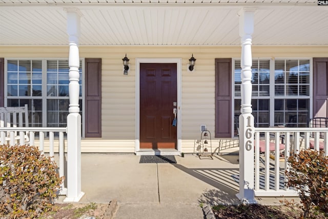 property entrance with covered porch